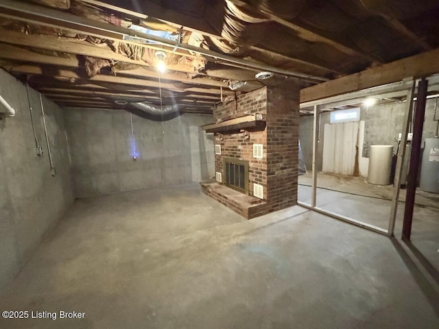 basement with a brick fireplace