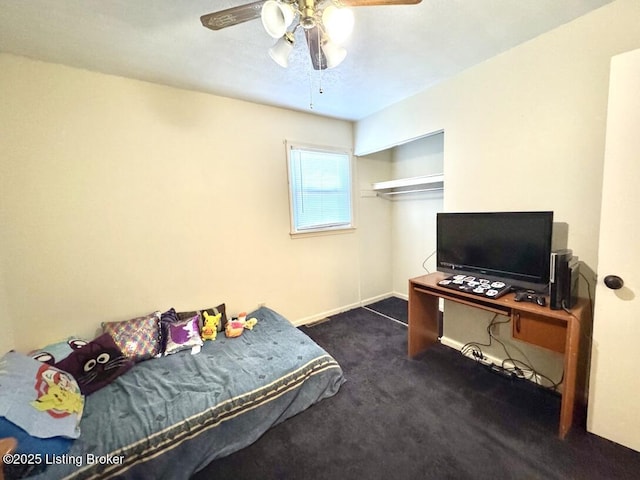 carpeted bedroom featuring a closet and ceiling fan