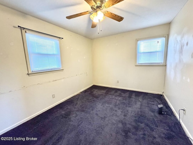 carpeted empty room with ceiling fan