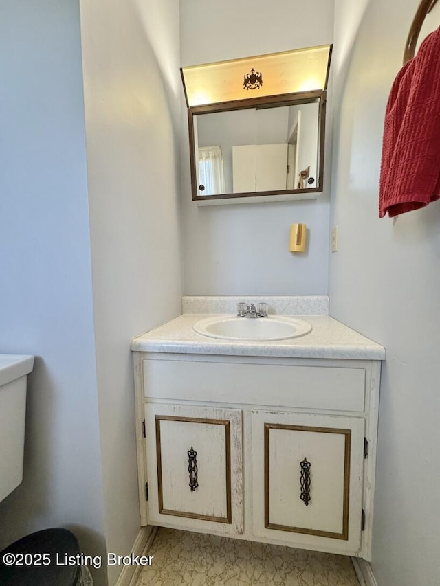 bathroom with vanity and toilet