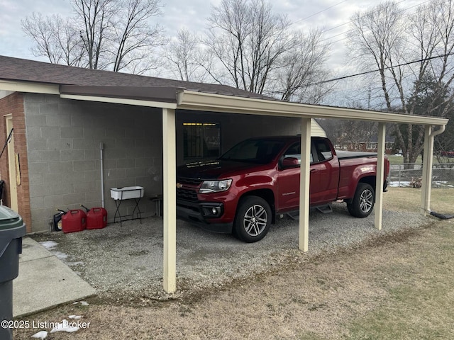 view of parking / parking lot with a carport