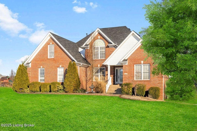 traditional-style home with brick siding and a front yard