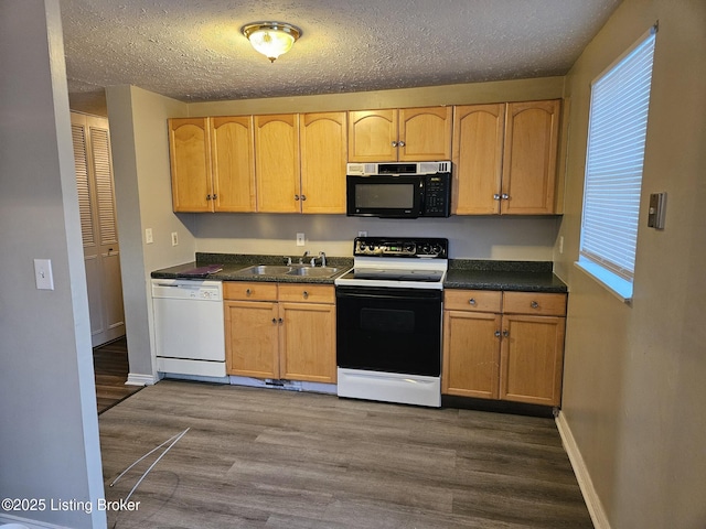 kitchen with white dishwasher, sink, a textured ceiling, and electric range