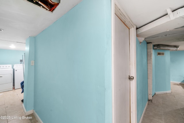 hallway featuring separate washer and dryer