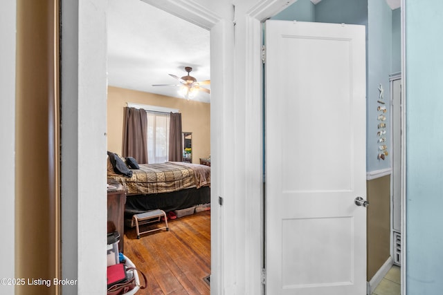 bedroom with ceiling fan and light hardwood / wood-style floors