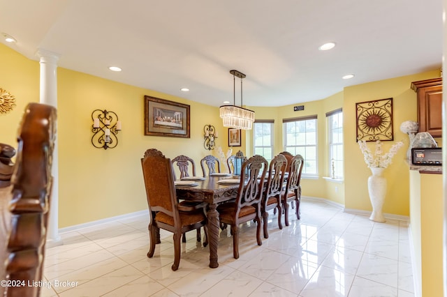 dining area with ornate columns