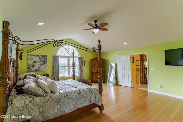 bedroom featuring lofted ceiling, light wood-type flooring, and ceiling fan