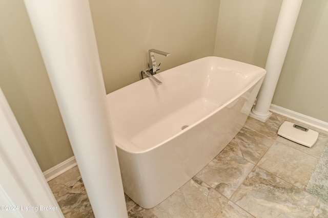 bathroom with a tub to relax in