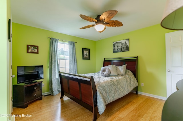 bedroom featuring ceiling fan and light wood-type flooring