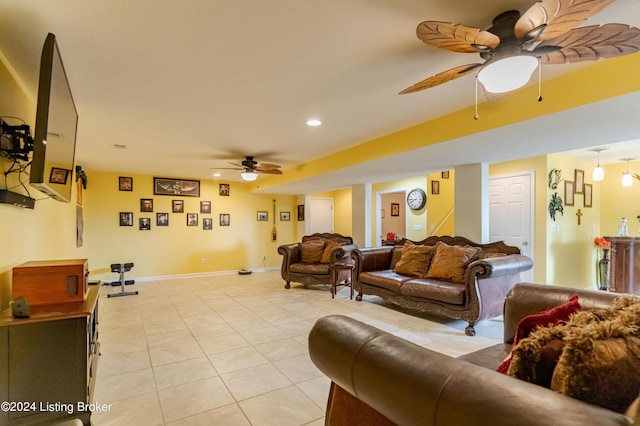 tiled living room featuring ceiling fan