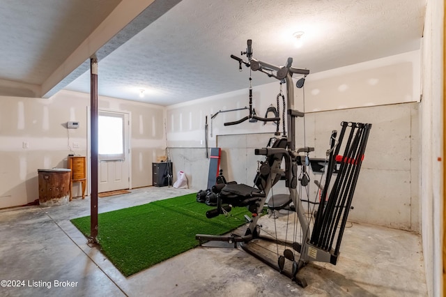 workout room with a textured ceiling