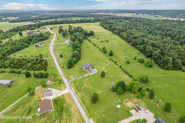 birds eye view of property with a rural view