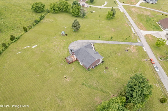 birds eye view of property with a rural view