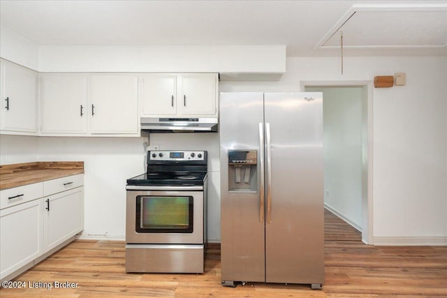 kitchen with white cabinetry, light hardwood / wood-style flooring, wooden counters, and appliances with stainless steel finishes