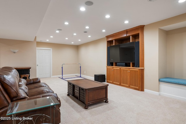 living area with baseboards, recessed lighting, and light colored carpet