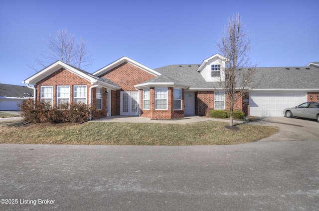 view of front facade with a garage and a front lawn