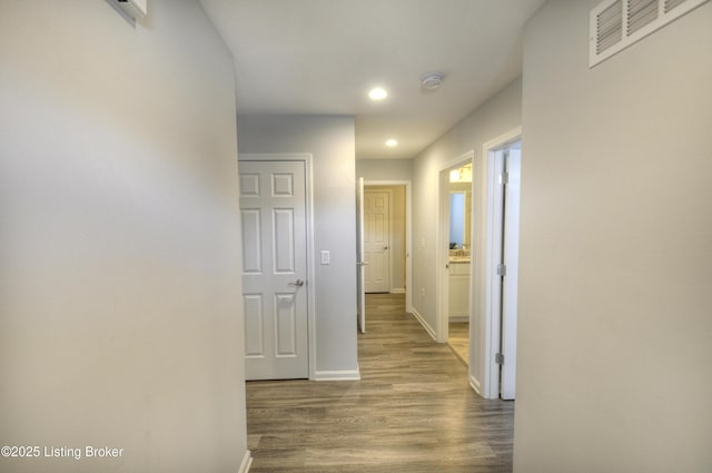 hall with wood-type flooring