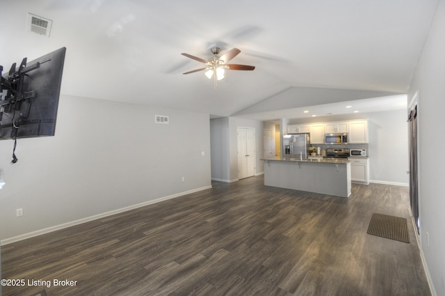 unfurnished living room with vaulted ceiling, ceiling fan, and dark hardwood / wood-style flooring