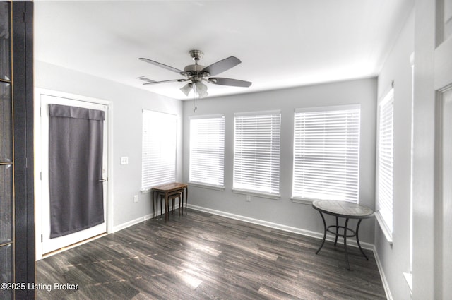 interior space featuring ceiling fan and dark hardwood / wood-style flooring