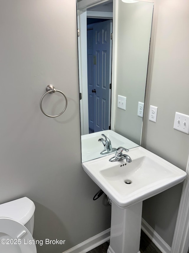 bathroom with sink and toilet