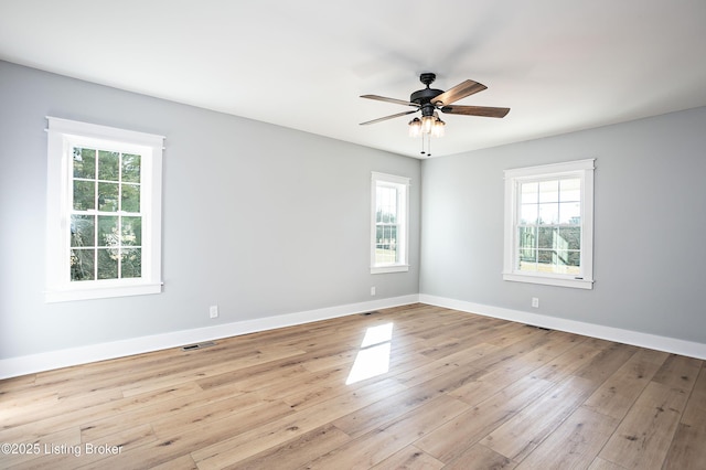 spare room featuring light hardwood / wood-style flooring and ceiling fan