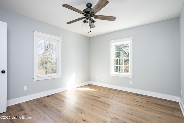 spare room featuring ceiling fan and light wood-type flooring