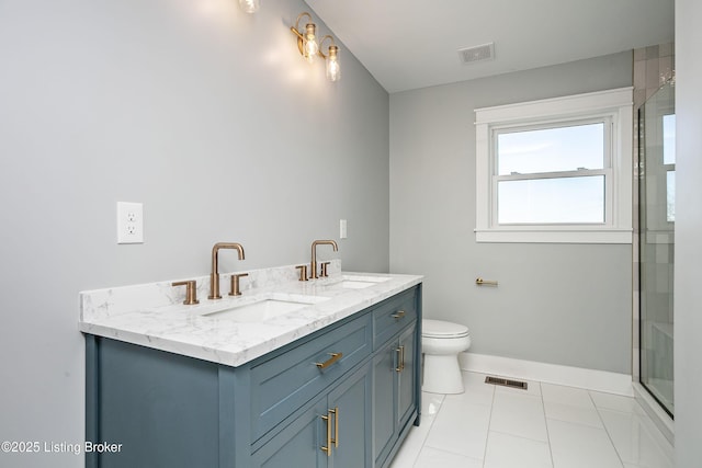 bathroom with vanity, tile patterned flooring, a shower with shower door, and toilet