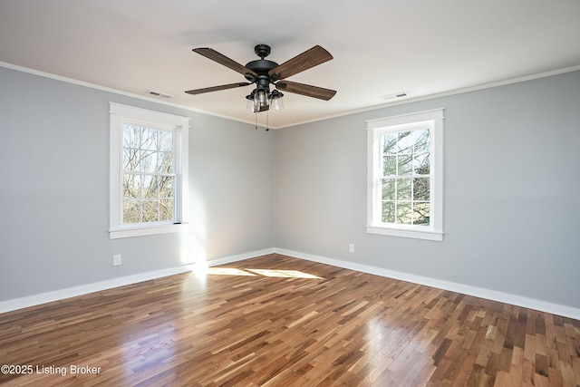 unfurnished room featuring ceiling fan, ornamental molding, and hardwood / wood-style floors