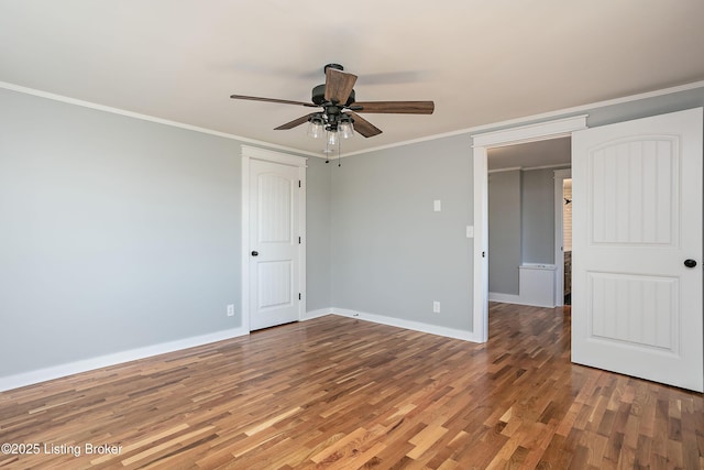 unfurnished room featuring hardwood / wood-style floors, ornamental molding, and ceiling fan