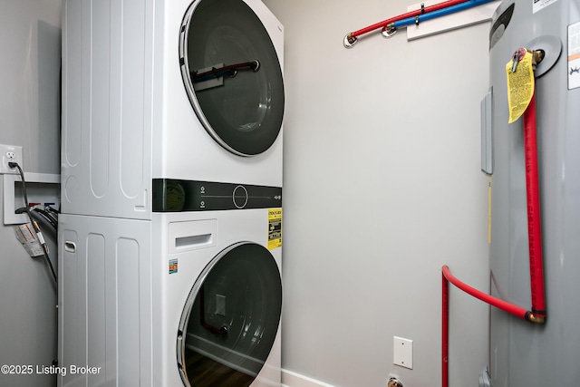 laundry room featuring stacked washer and clothes dryer and electric water heater