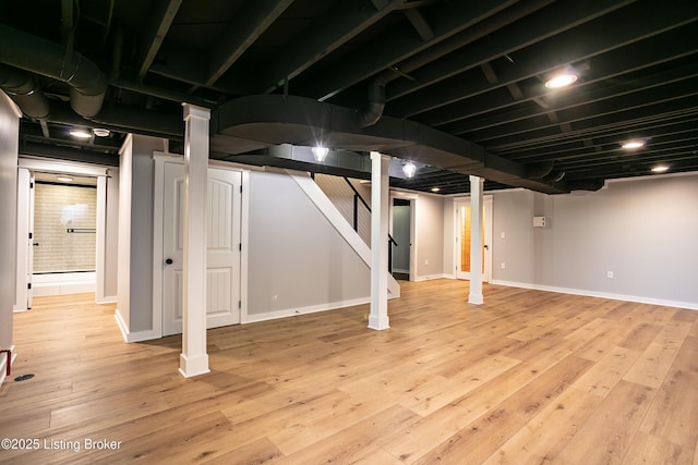 basement featuring light hardwood / wood-style floors