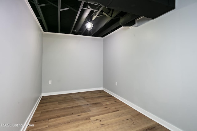 basement featuring hardwood / wood-style flooring