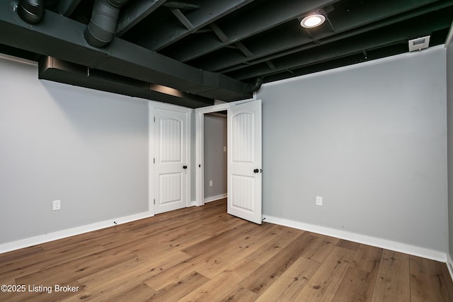 basement featuring light hardwood / wood-style flooring