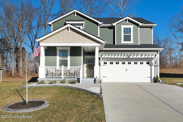 craftsman-style home with a garage, covered porch, and a front yard