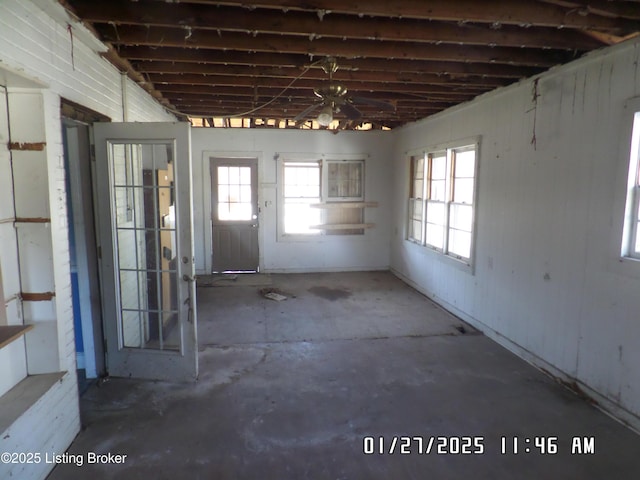 misc room with concrete flooring