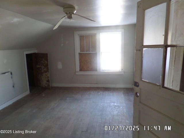 bonus room featuring lofted ceiling, hardwood / wood-style flooring, and ceiling fan