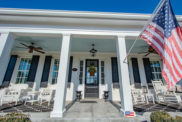 doorway to property featuring ceiling fan and covered porch