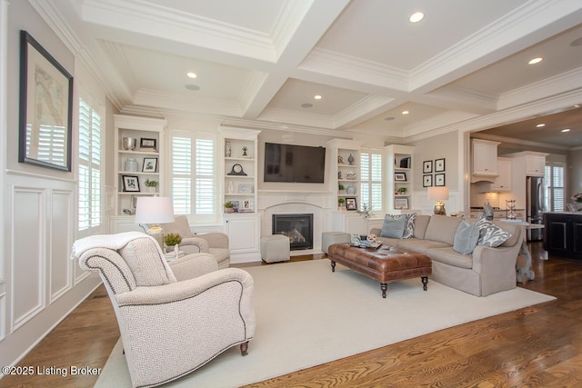 living room with built in features, beamed ceiling, ornamental molding, coffered ceiling, and dark wood-type flooring