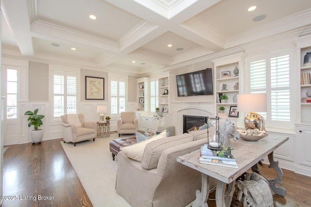 living room with beam ceiling and a wealth of natural light