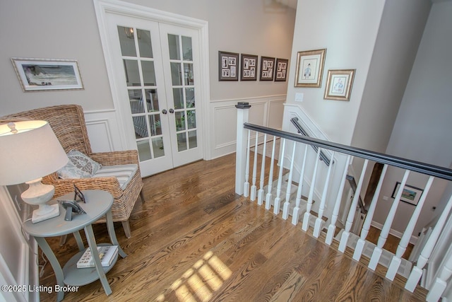 interior space with french doors and hardwood / wood-style floors