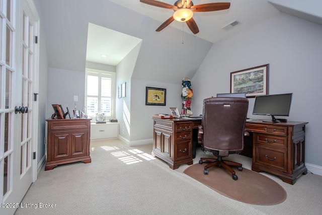 carpeted office featuring lofted ceiling and ceiling fan