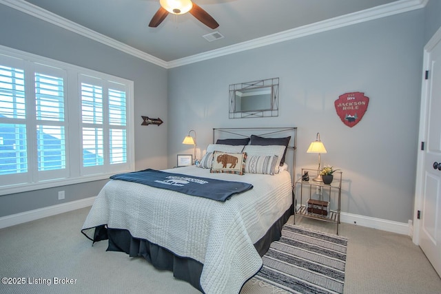 bedroom featuring ornamental molding, carpet flooring, and ceiling fan