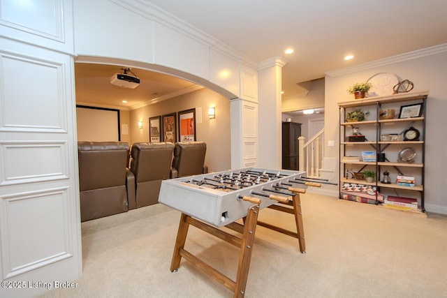 recreation room with crown molding and light colored carpet