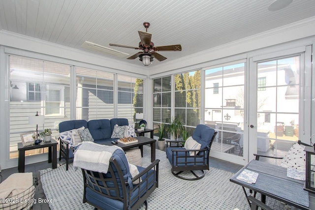 sunroom featuring ceiling fan