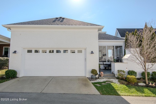 view of front of property with a garage