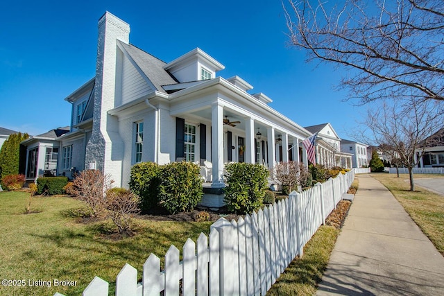 view of property exterior featuring ceiling fan, a porch, and a yard