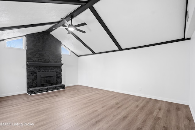 unfurnished living room with a fireplace, light hardwood / wood-style floors, ceiling fan, and plenty of natural light