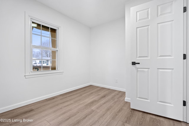 unfurnished room with light hardwood / wood-style flooring