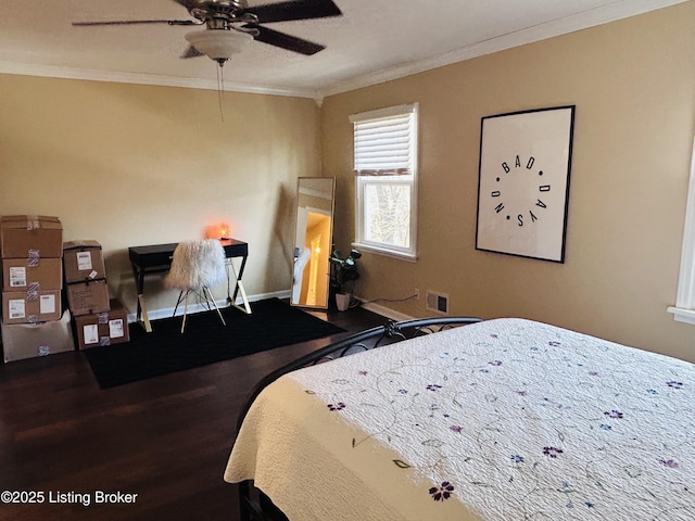 bedroom with crown molding, ceiling fan, and hardwood / wood-style flooring