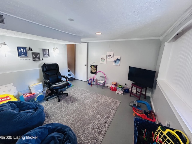 rec room featuring ornamental molding, concrete flooring, and a textured ceiling